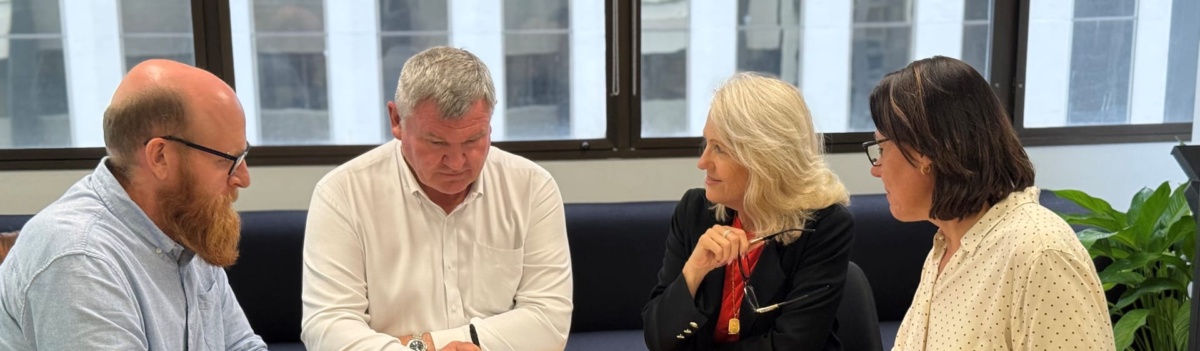 TransCoal team in discussion at the Brisbane office