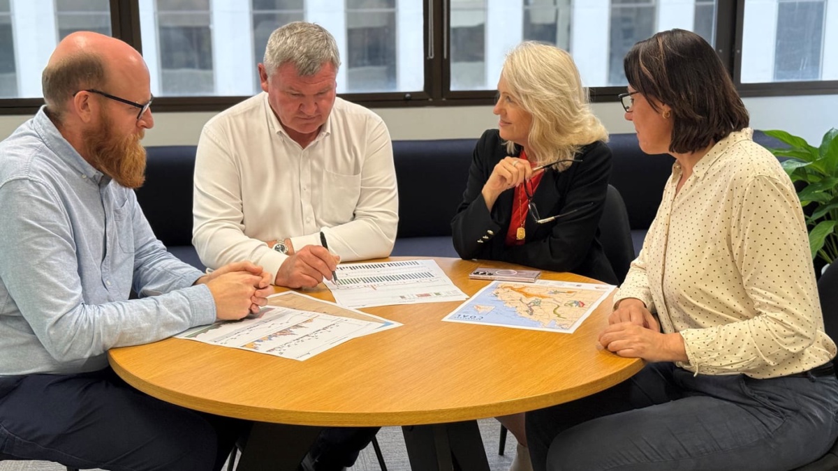 TransCoal team reviewing shipment plans at the Brisbane office